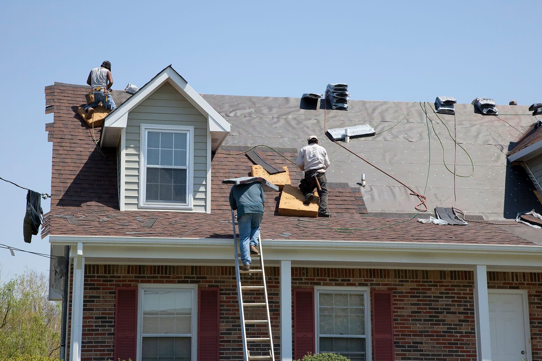roof replacement contractor installing new shingles in Palm Beach and Broward Counties Florida