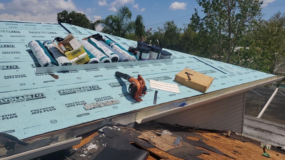 roof replacement contractor installing new shingles in Palm Beach and Broward Counties Florida